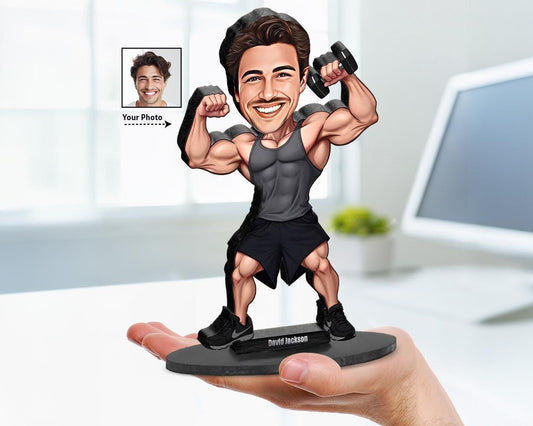 big-head caricature of a male bodybuilder holding dumbbells, printed on wood or acrylic, standing pose, white background