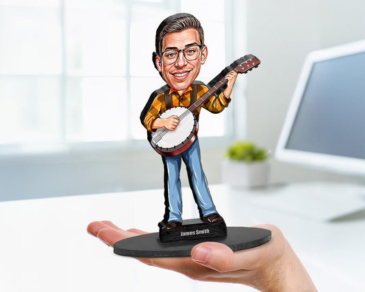Big-head cartoon caricature of a male banjo player, custom-made from a photo, printed on clear acrylic or mounted on a wooden base.
