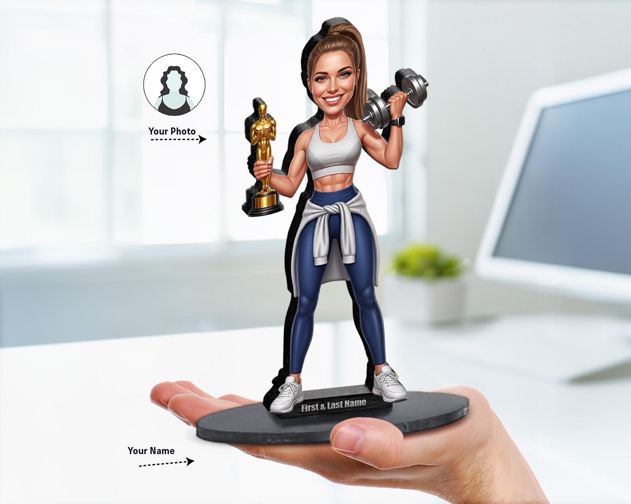 Big-head caricature of a female fitness coach holding a trophy and dumbbell, printed on wood or acrylic, standing pose, white background.