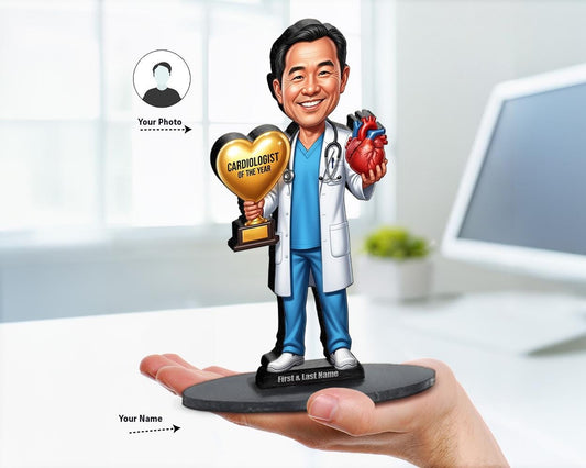 Big-head caricature of a male cardiologist in scrubs and white coat, holding a gold heart-shaped trophy and anatomical heart, printed on wood or acrylic, white background.
