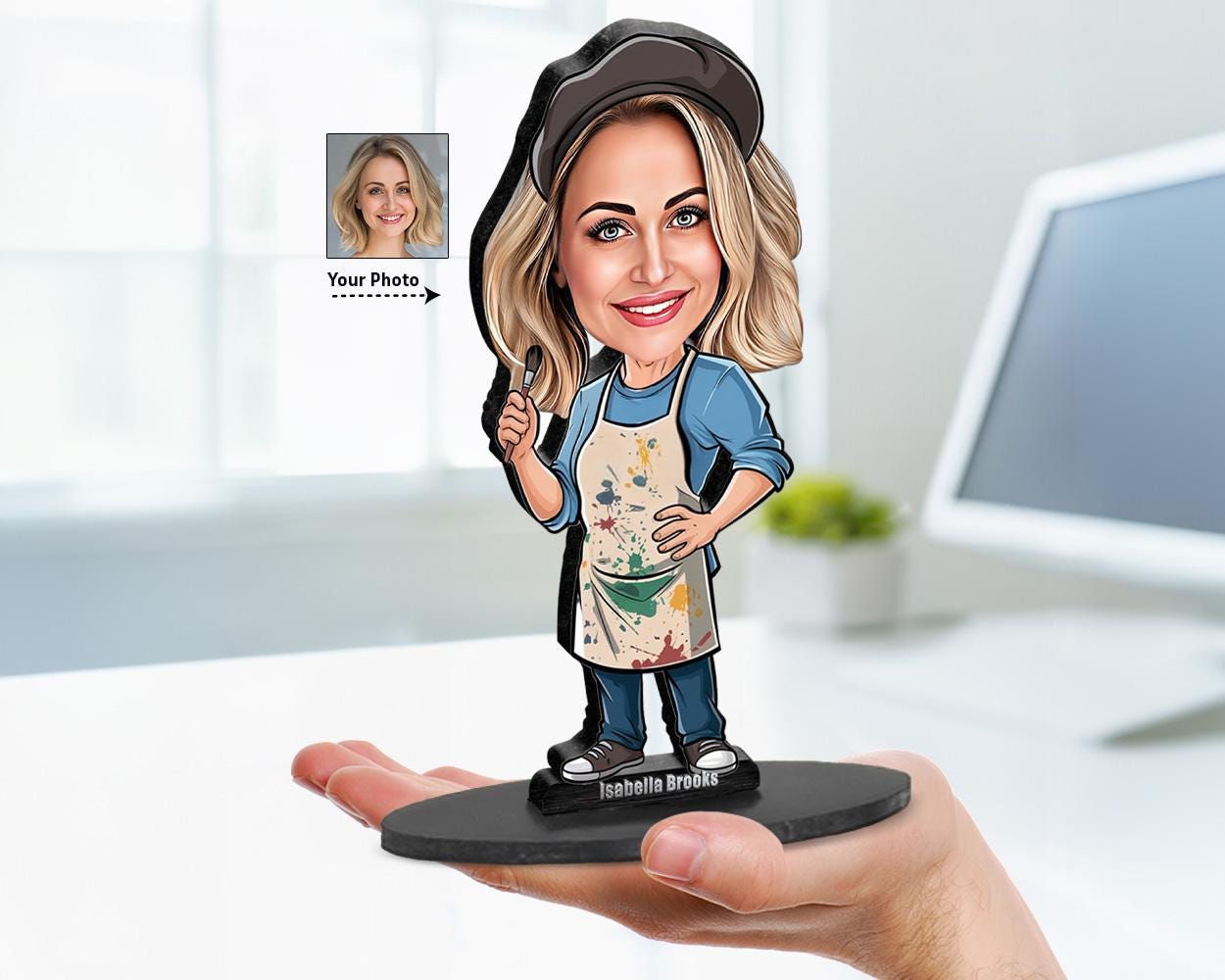 Big-head cartoon caricature of a female artist in a paint-stained apron and cap, custom-made from a photo, printed on clear acrylic or wood base.