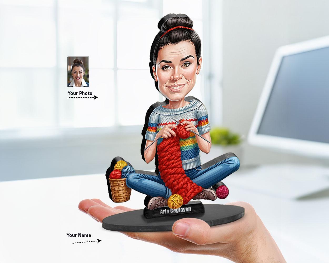 Big-head cartoon caricature of a knitting woman with yarn basket, custom-made from a photo, printed on clear acrylic or mounted on a wooden base.