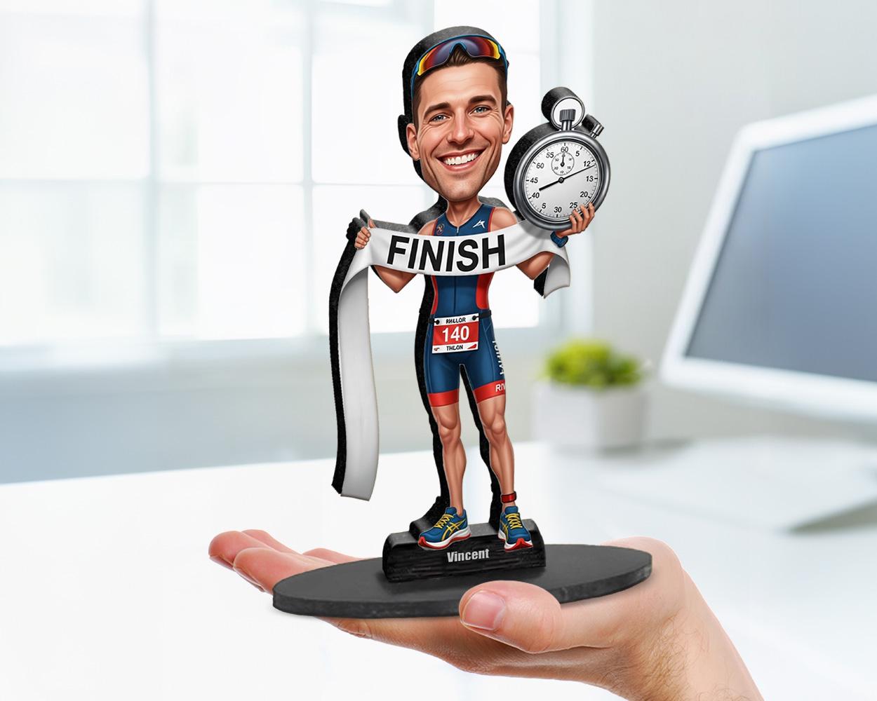Big-head cartoon caricature of a male triathlete, custom-made from a photo, featuring swim, bike, and run elements, printed on acrylic or mounted on a wooden base.