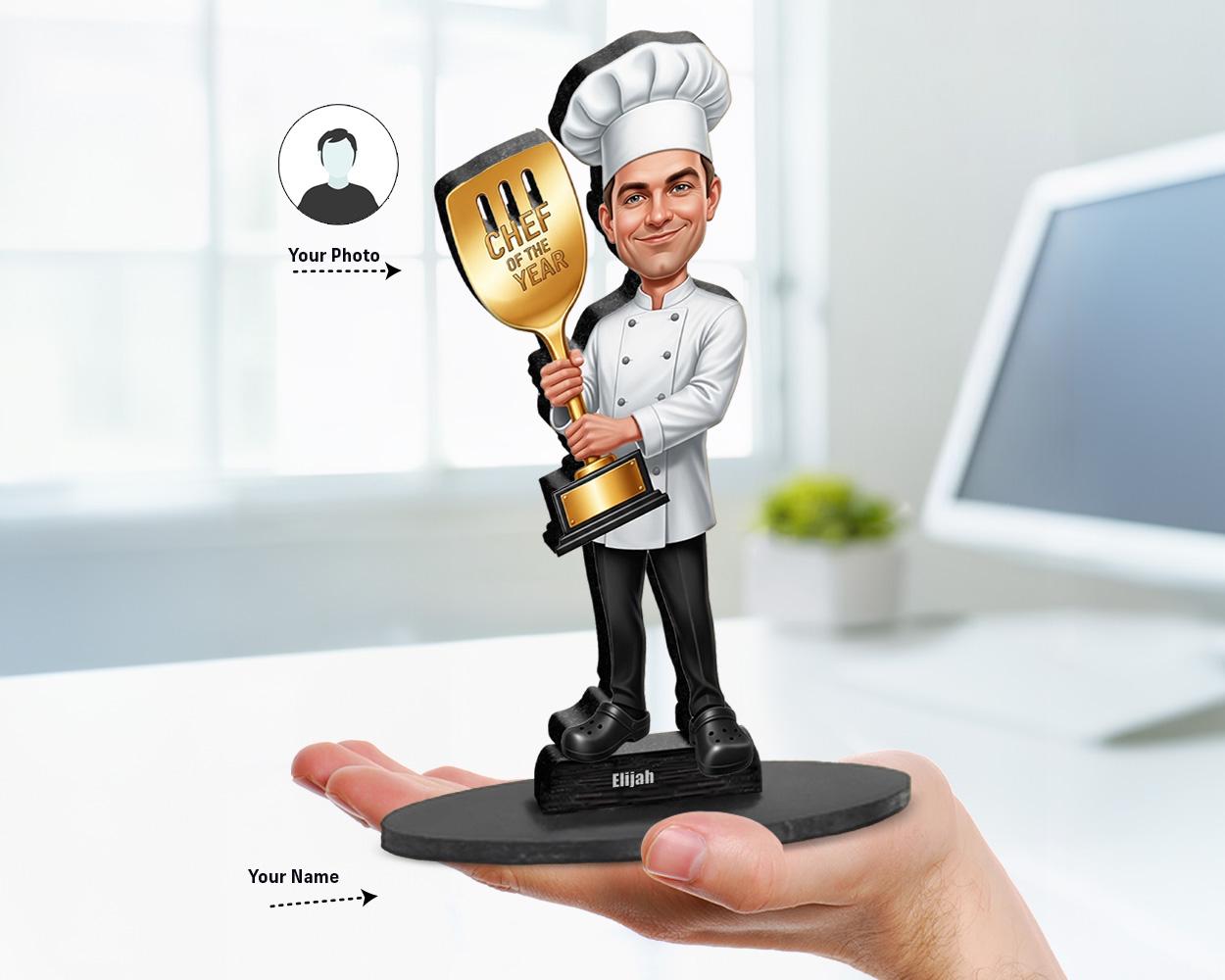 Big-head caricature of a chef holding a trophy or award, printed on wood or acrylic, standing pose, white background.